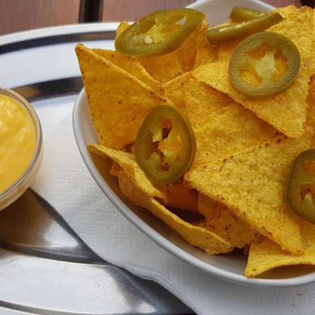 Nacho chips with jalapeno peppers